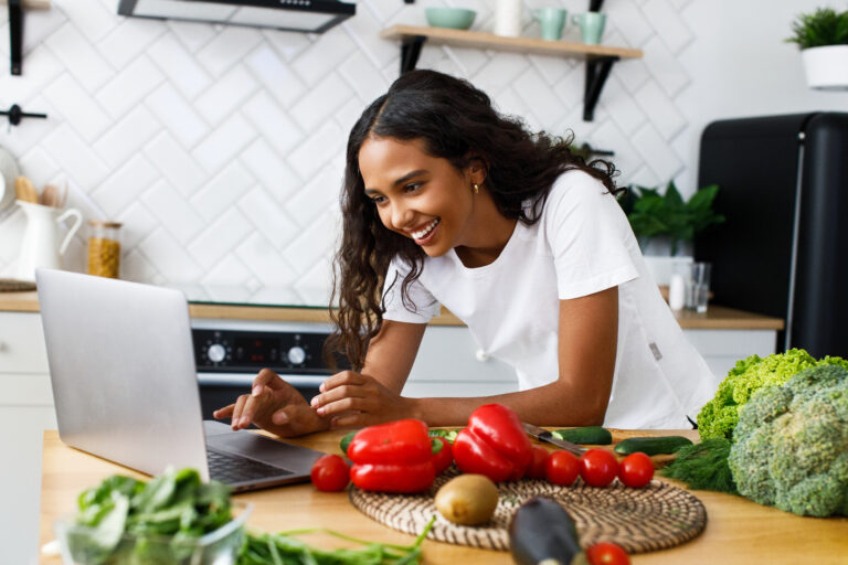 Smiled,Pretty,Girl,Is,Looking,On,The,Laptop,Screen,On